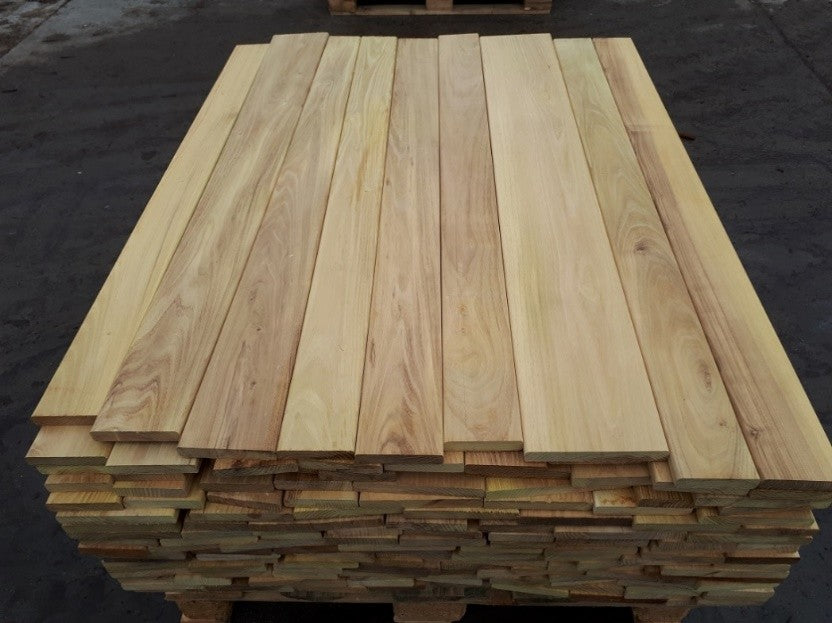 Stack of wooden planks on a dark background