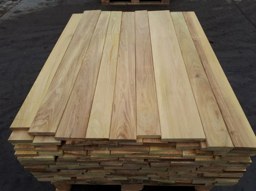 Stack of wooden planks on a dark background