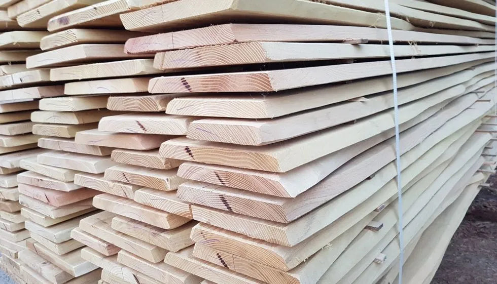 Stack of wooden planks with a clear plastic wrap