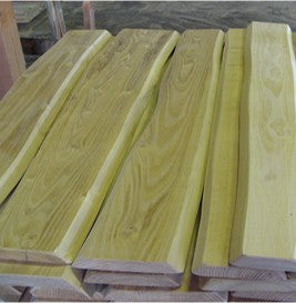 Wooden planks stacked on a wooden pallet